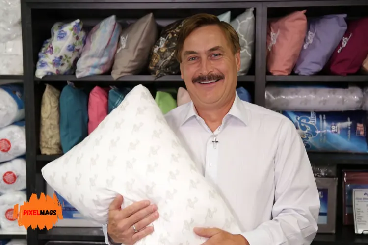 Mike Lindell smiling while holding a white pillow.