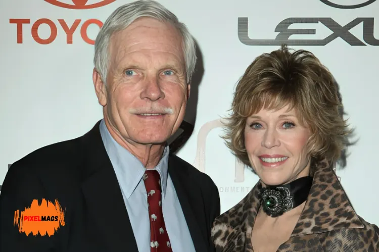 Ted Turner stands with wife The background features logos including 'Toyota' and 'Lexus.