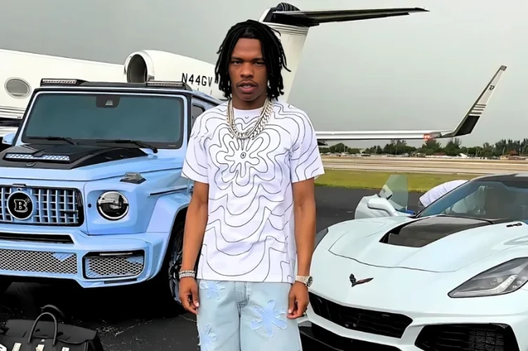 Lil Baby with mansion and cars