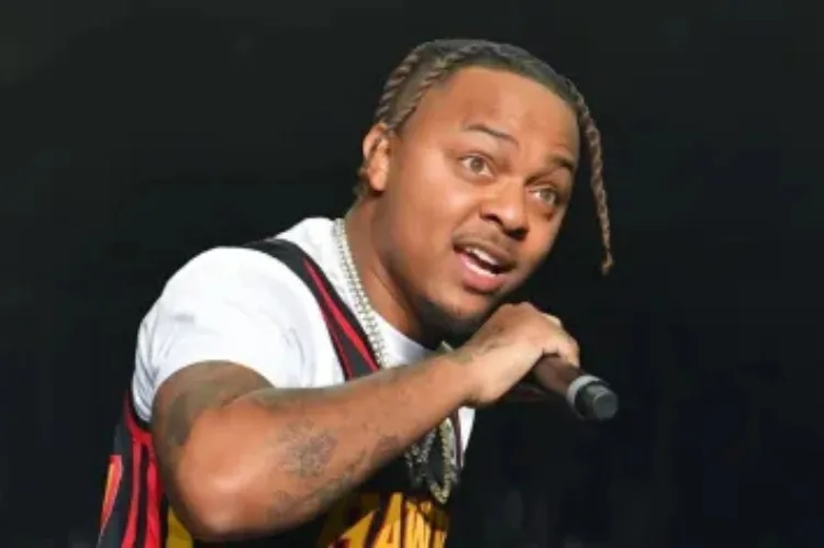 enerate a dynamic image of Bow Wow performing on stage during his peak 2000s era.