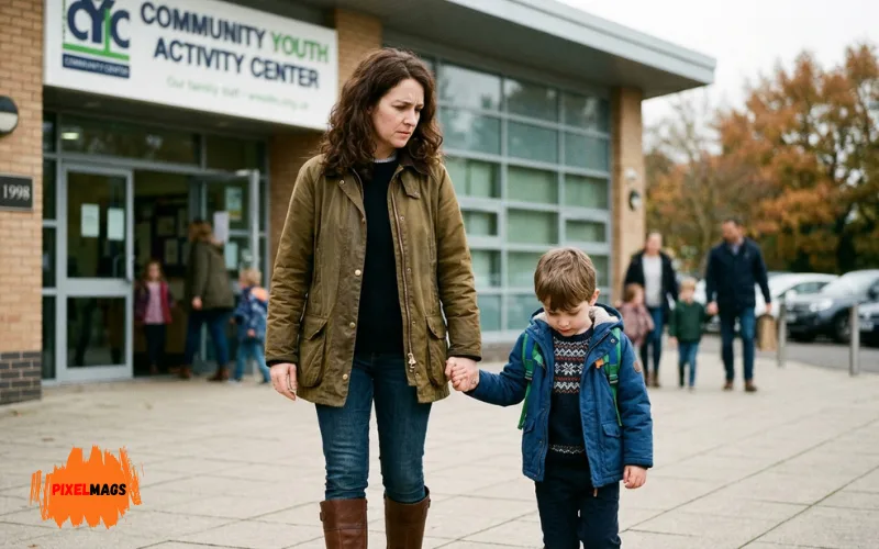 Protective parent holding child’s hand outside youth activity center, serious thoughtful mood.